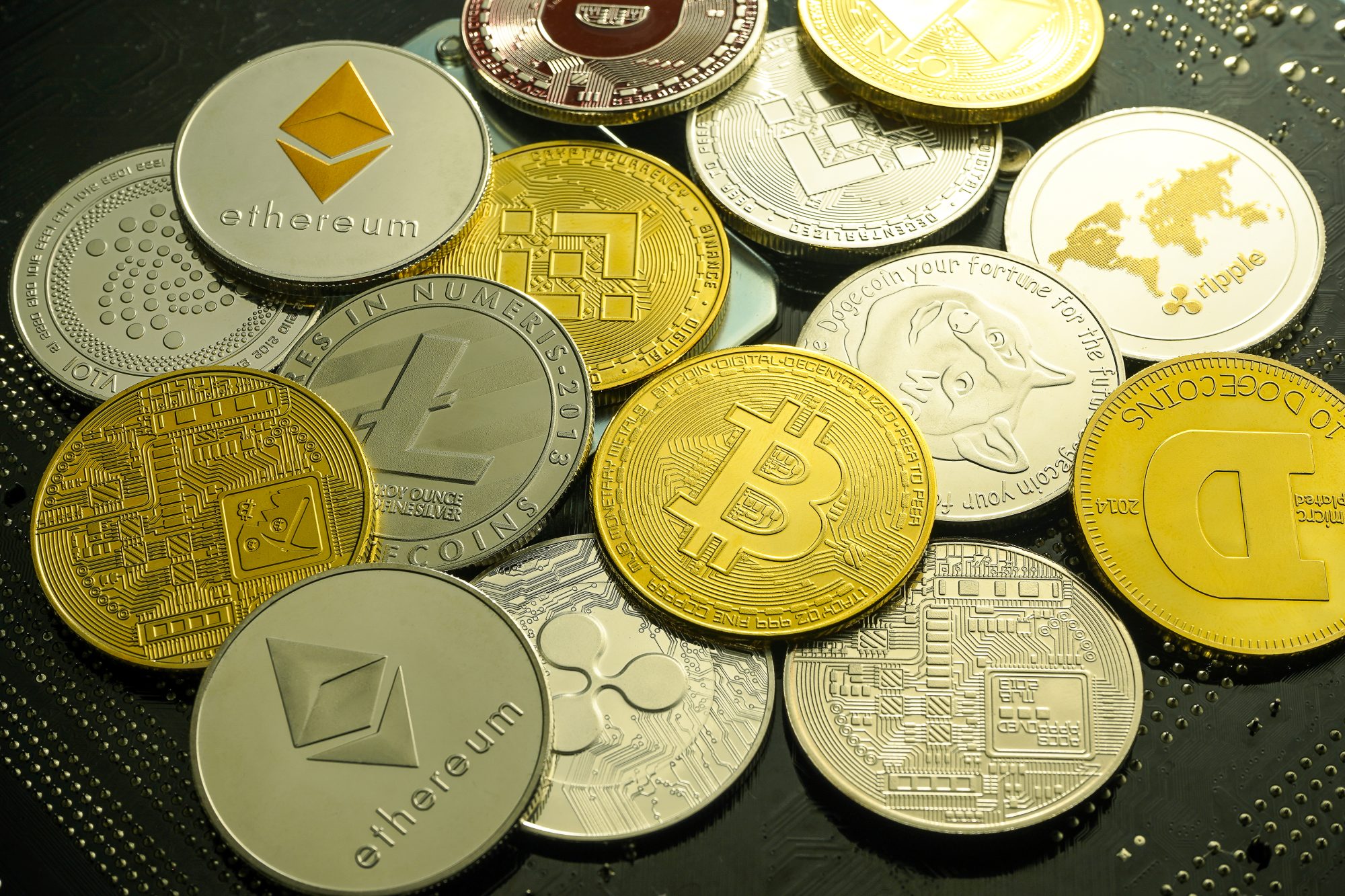 Gold coins representing different cryptocurrencies